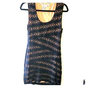 Tan dress with black lace overlay, above the knee